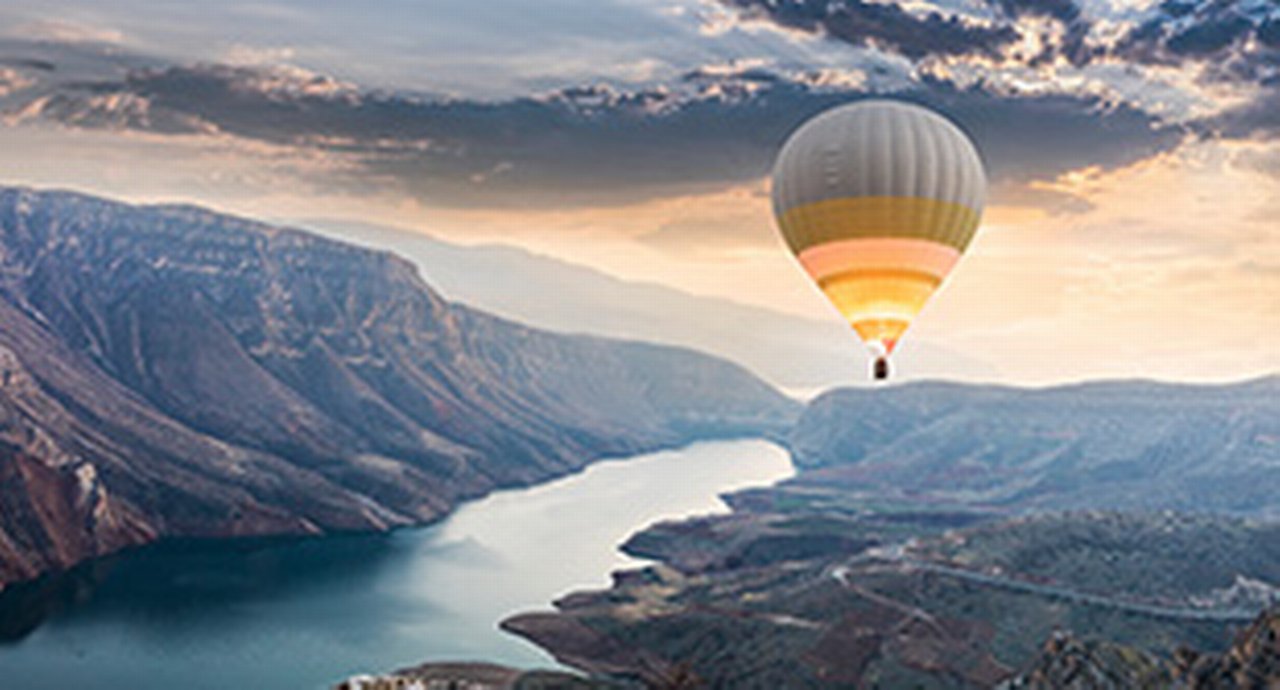 Hot air balloons flying over the Botan Canyon in Turkey