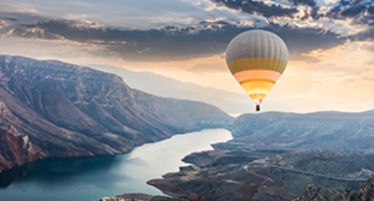 Hot air balloons flying over the Botan Canyon in Turkey