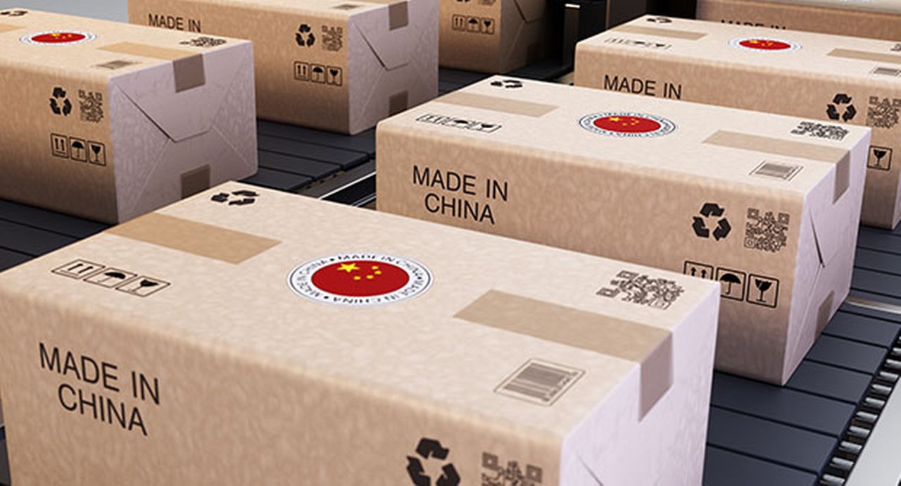 Shipping Boxes Marked With Chinese Symbols Stacked In A Warehouse For Distribution And Delivery