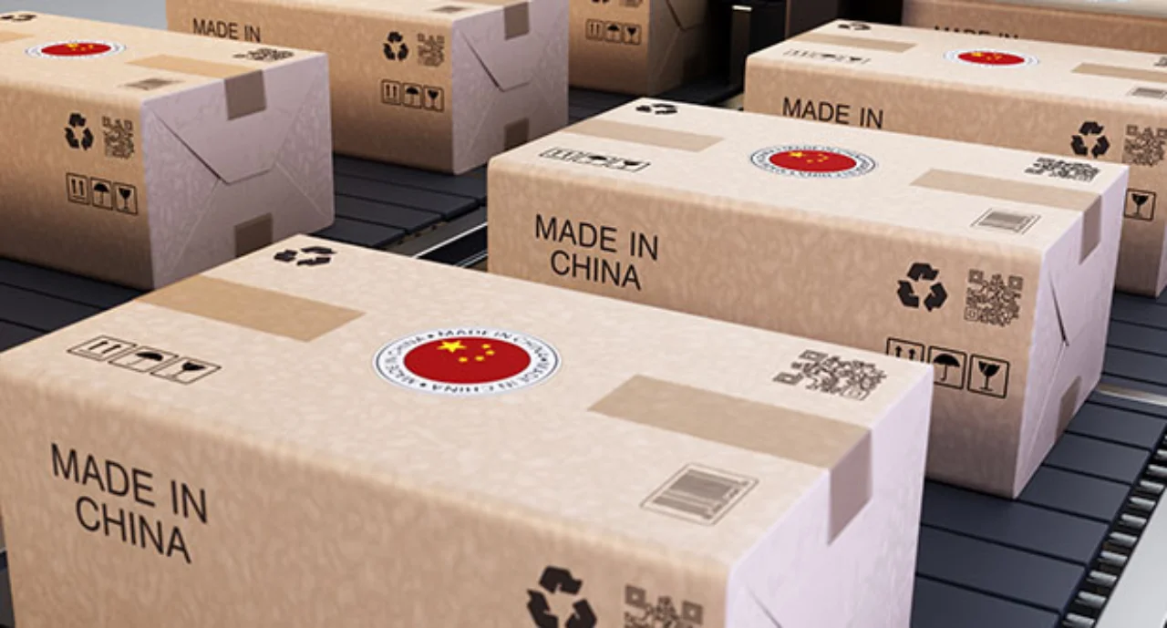 Shipping Boxes Marked With Chinese Symbols Stacked In A Warehouse For Distribution And Delivery