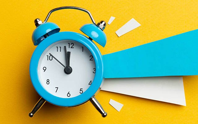 Clock on yellow background