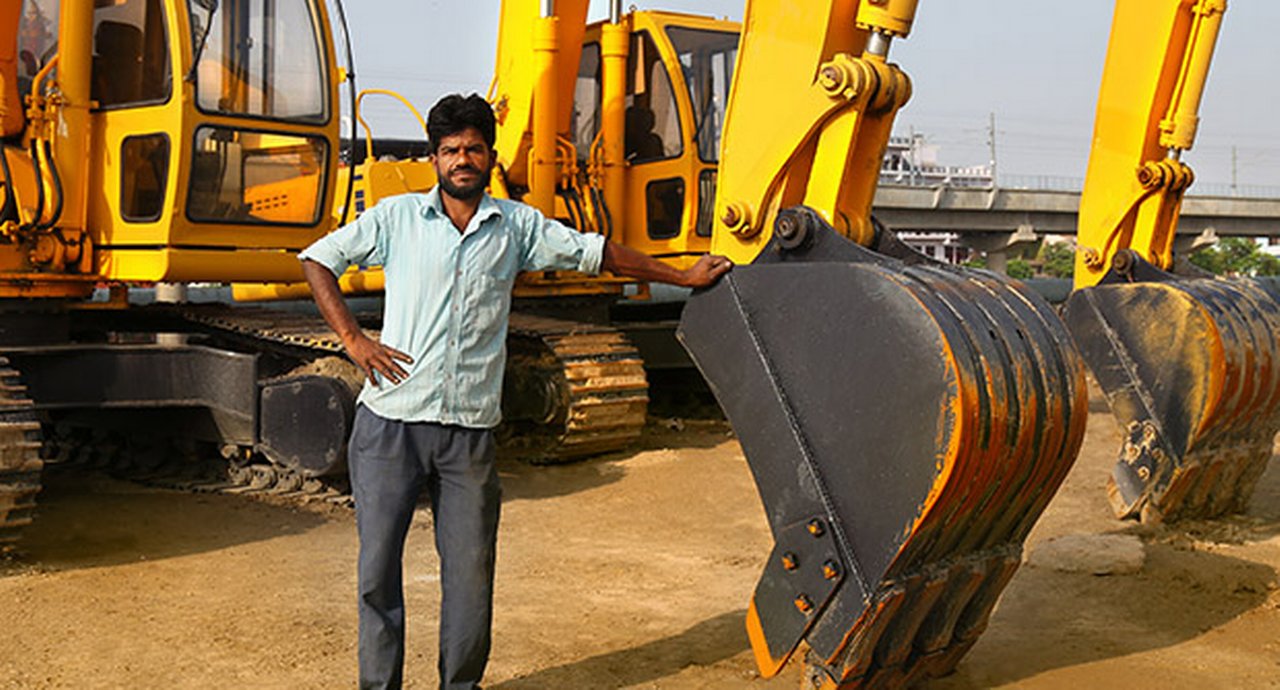 Construction worker near construction machinery