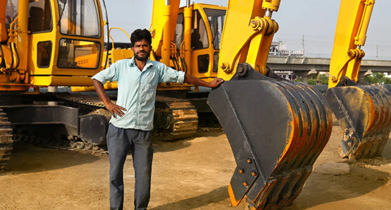Construction worker near construction machinery