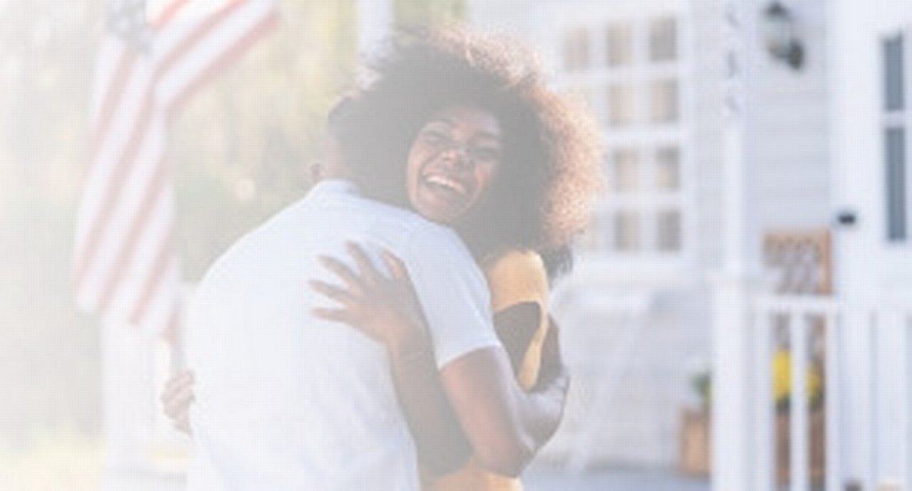 Woman Welcomes Her Husband On The Porch
