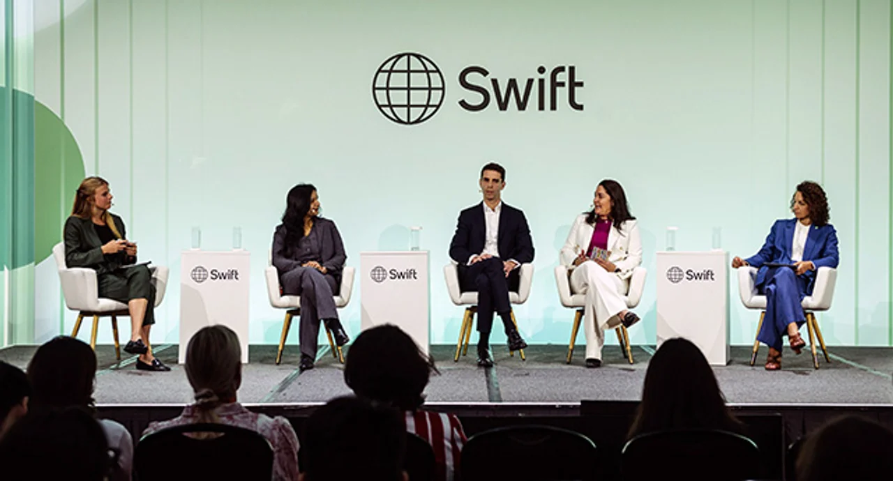 Five panelists participate in a discussion on stage at the Swift conference