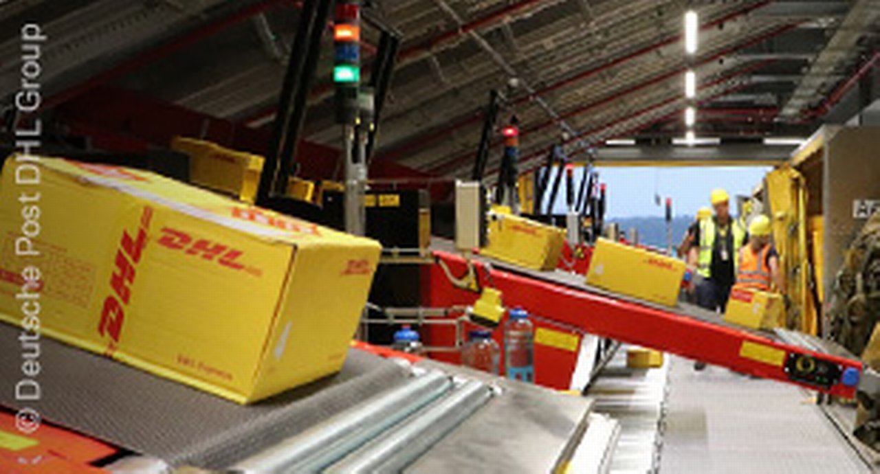 workers taking care of packages in a DHL warehouse
