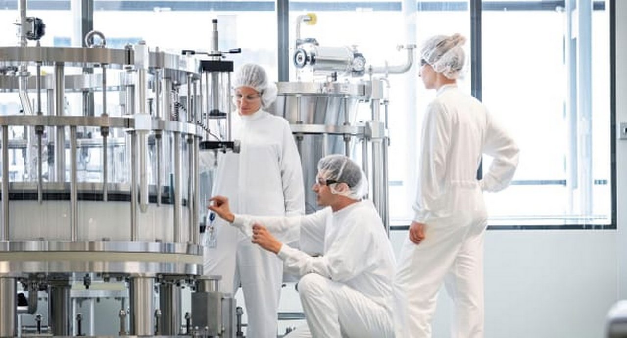Lab workers checking lab equipment