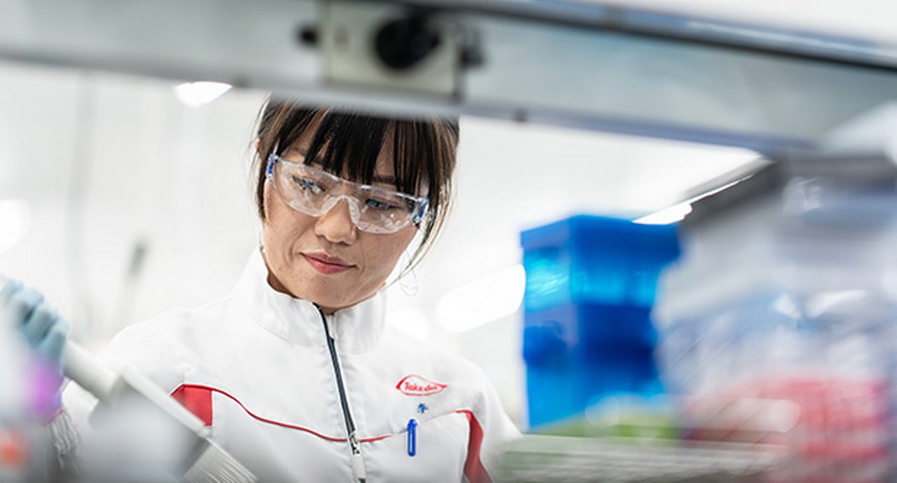 Takeda lab worker wearing safety glasses while in a lab