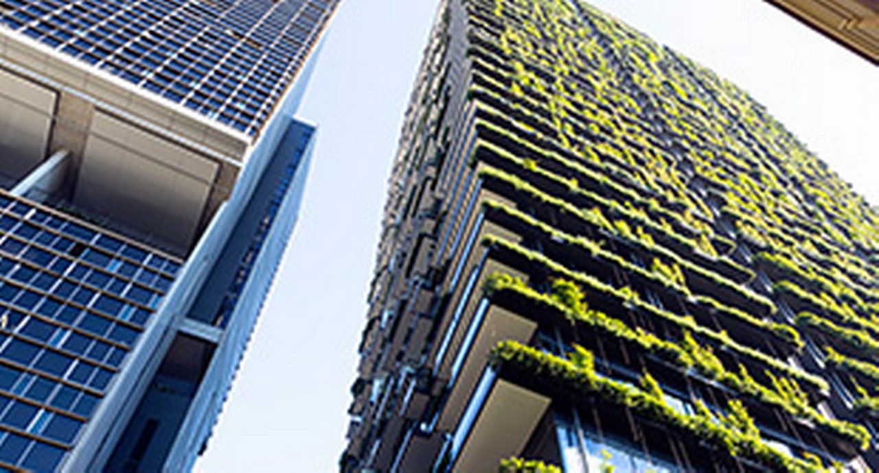 Low angle view of apartment building with vertical garden