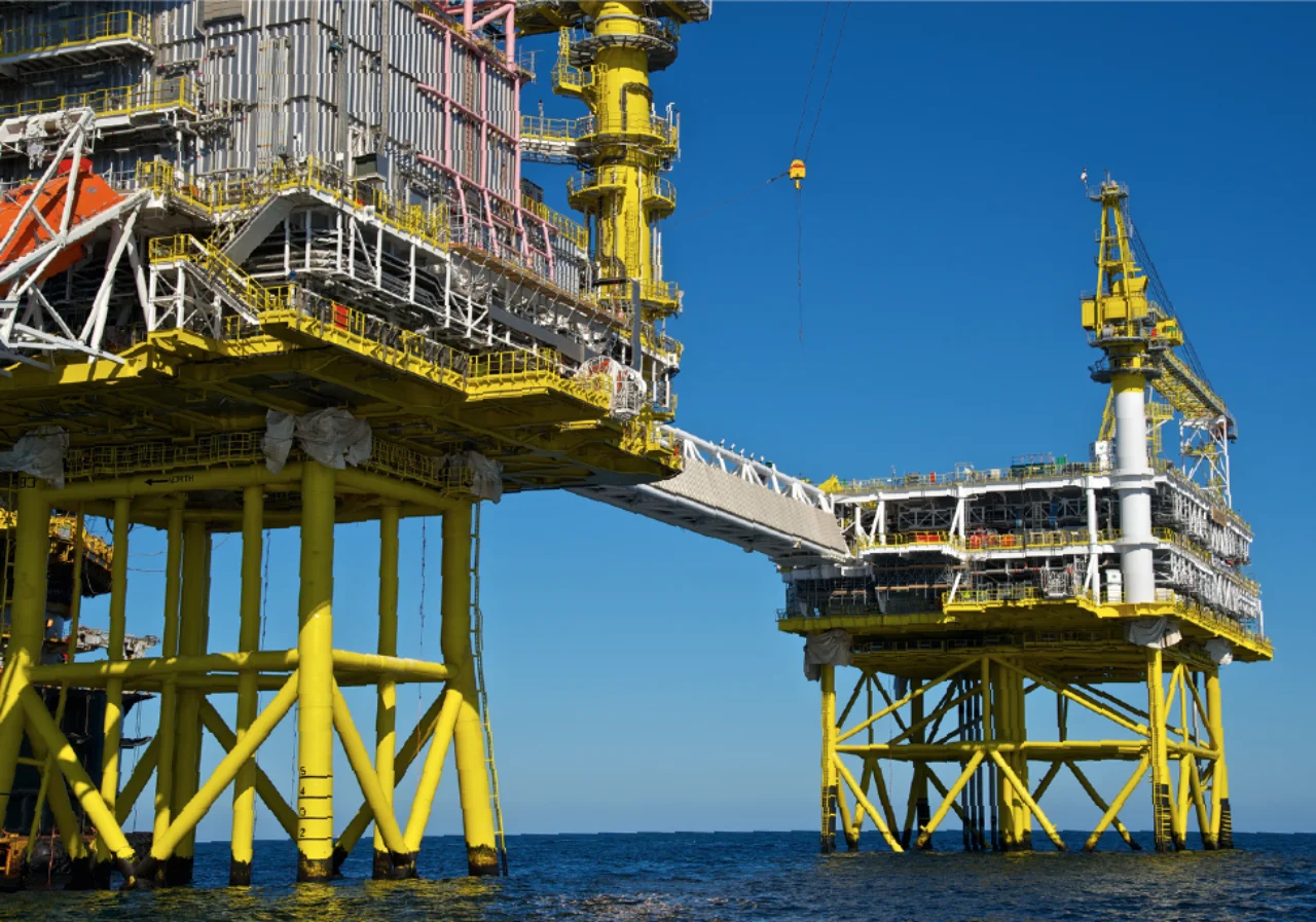 Two oil rigs connected trough a bridge