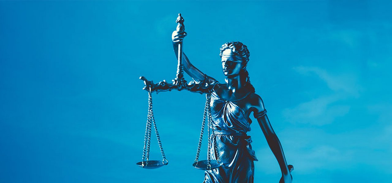 Statue of Lady Justice holding scales