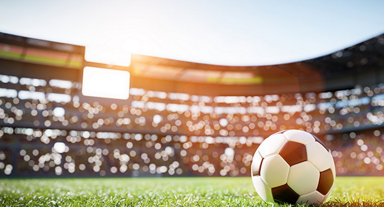 Football Soccer Ball On Grass Field in Stadium
