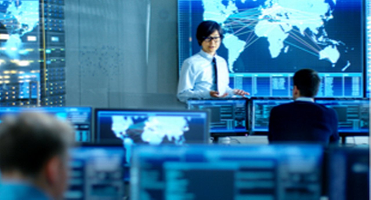 In the System Control Room Manager Holds a Briefing for His Staff Members
