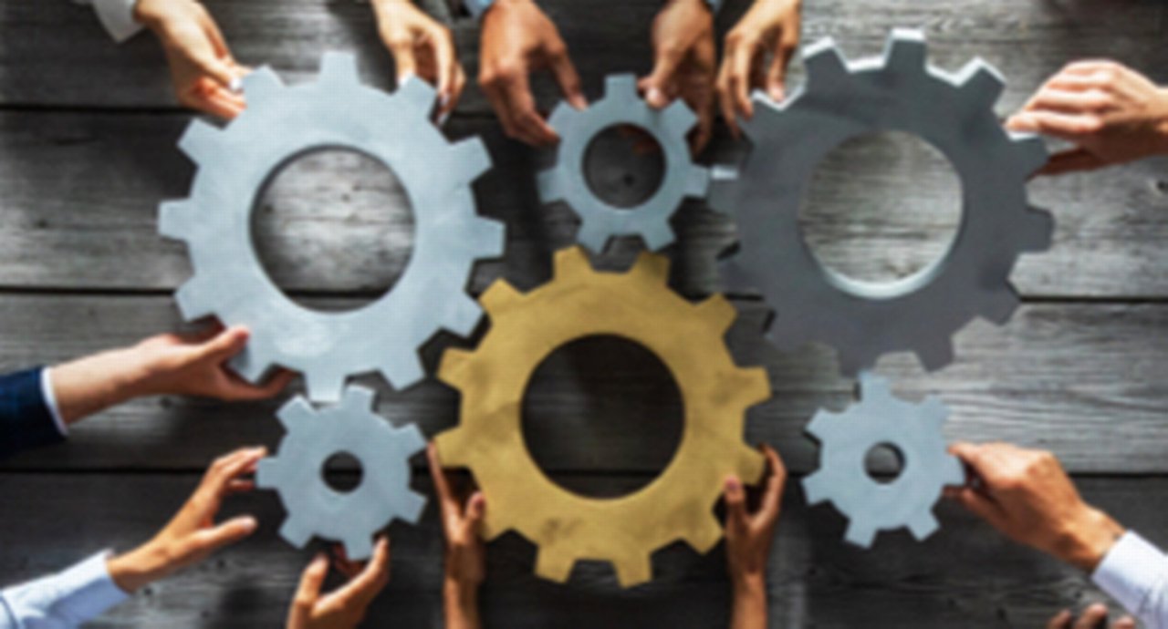 Business People Joining Gears