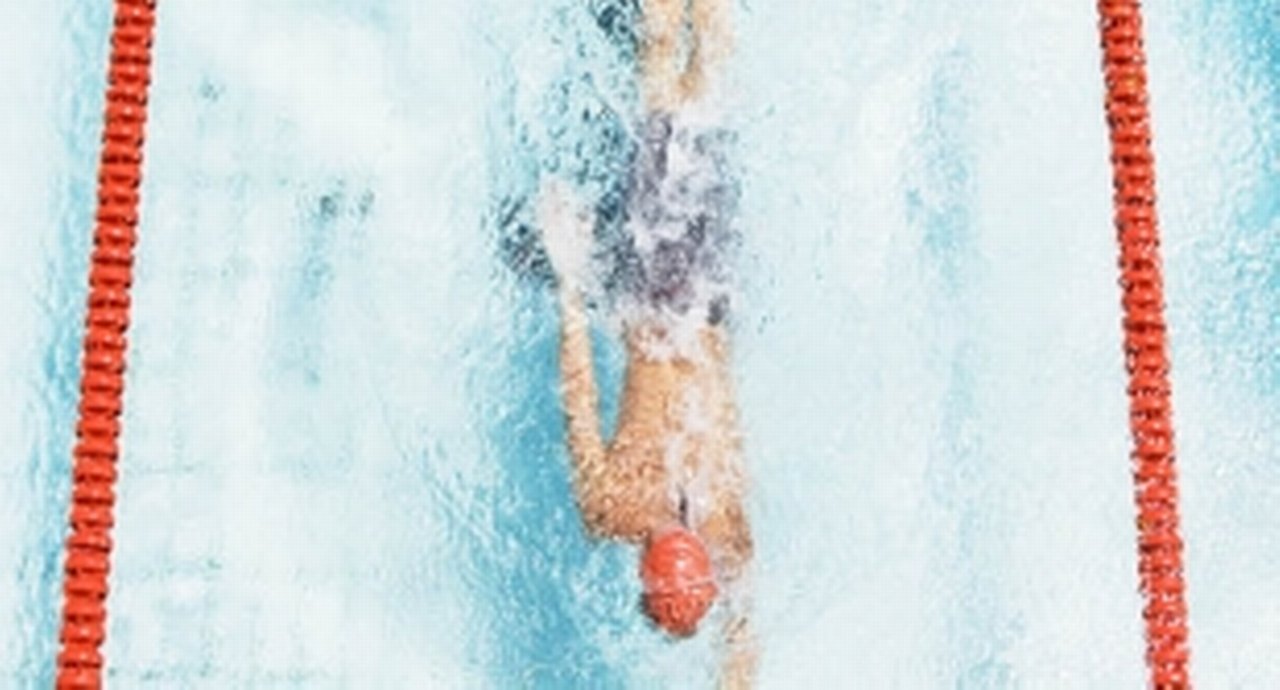 A lane swimmer glides quickly through the water