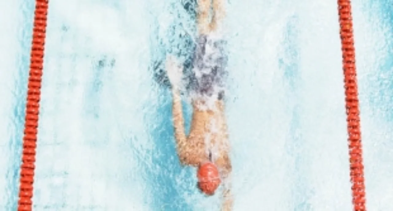 A lane swimmer glides quickly through the water