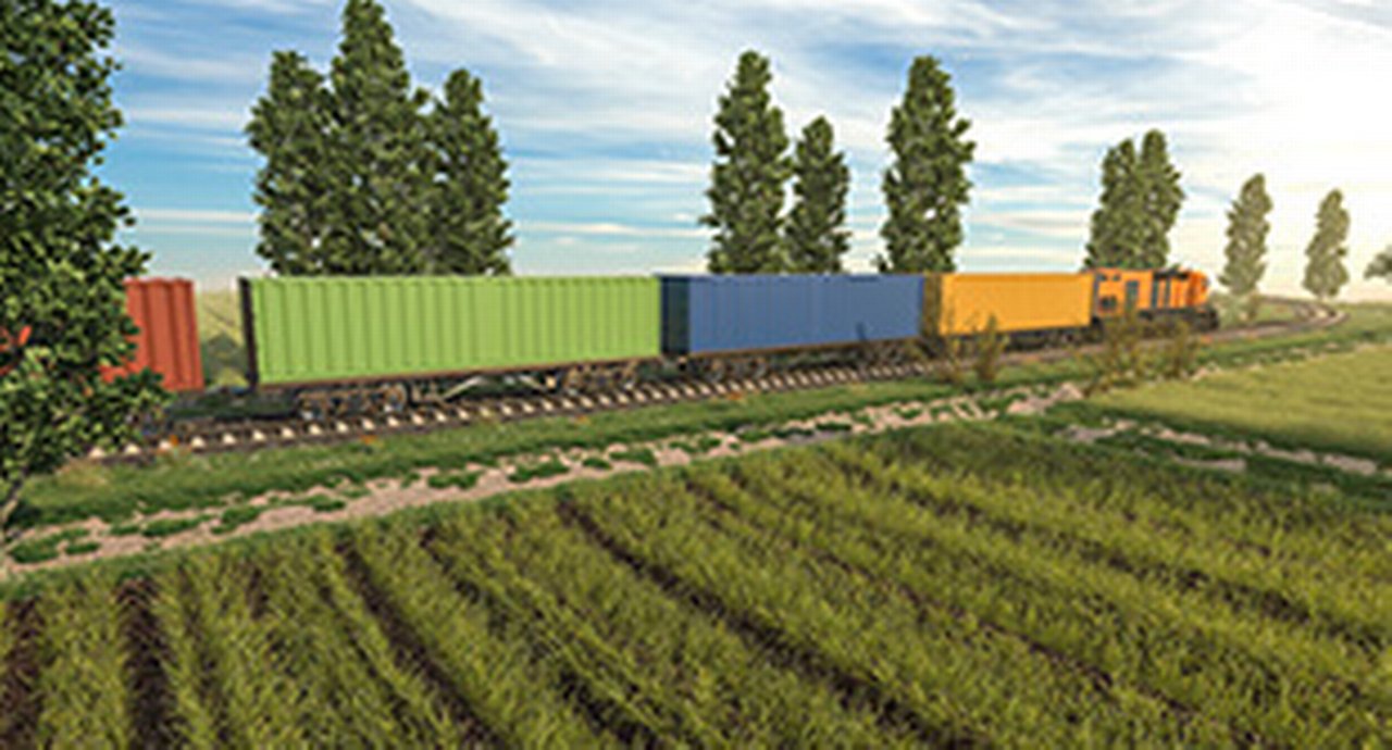 Train boxcars on a green field with trees