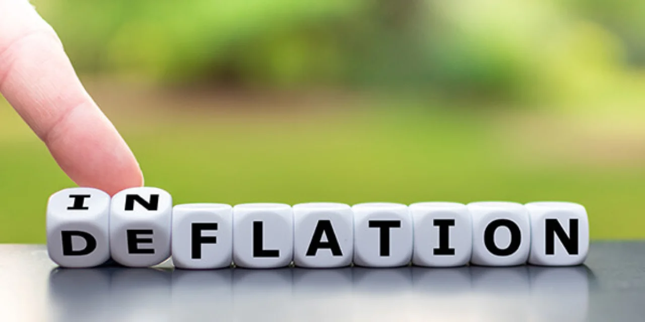 A row of cubes showing inflation, with the first two cubes rotated to show deflation