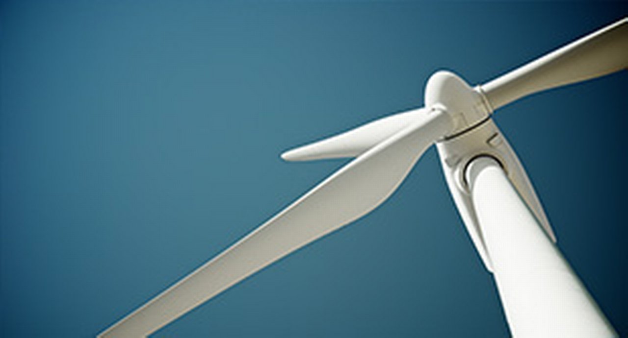 Close-up of a windmill against a deep blue background