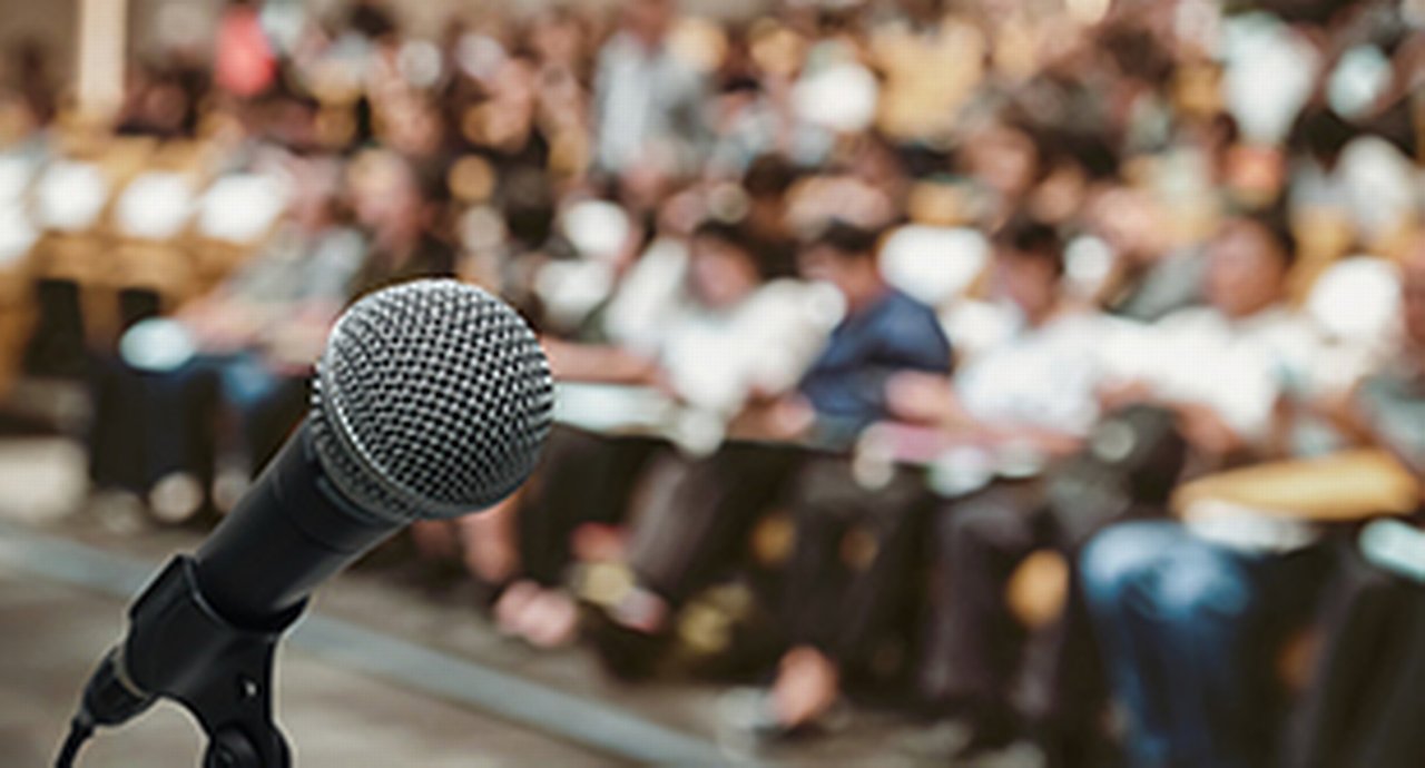 microphone in front of listening people