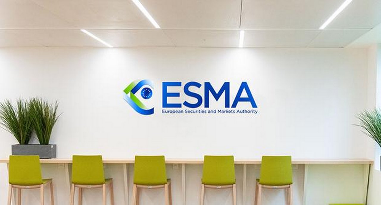 ESMA Logo set on a wall above green chairs