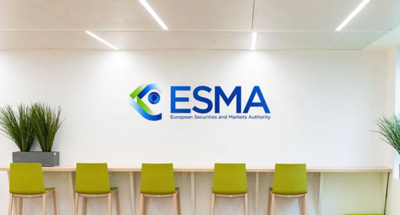 ESMA Logo set on a wall above green chairs