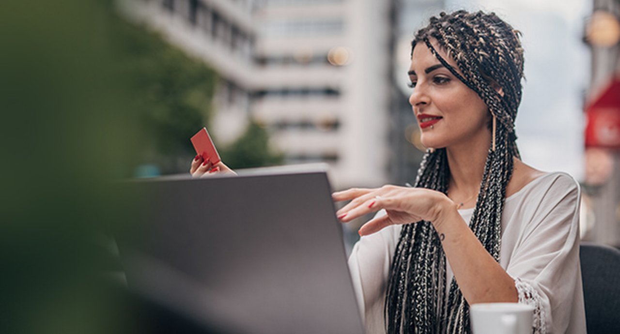 Woman with Laptop in Café