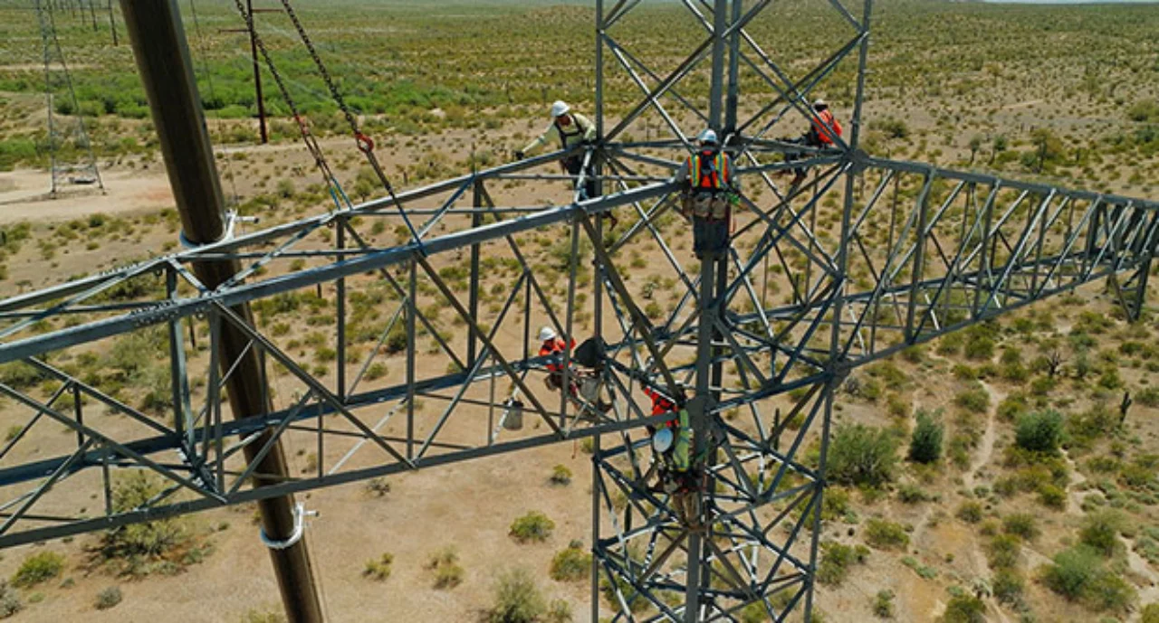 Electricians working on power lines