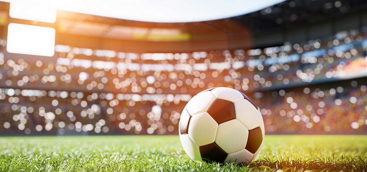 Football Soccer Ball On Grass Field in Stadium