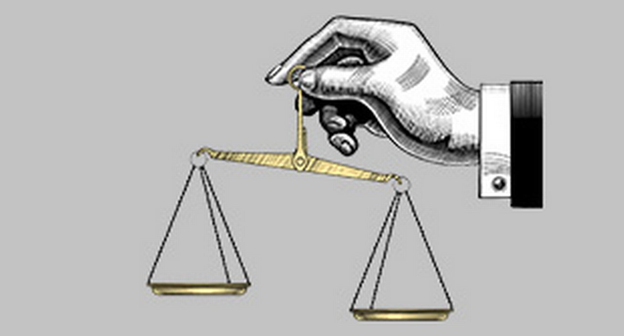 Graphic representation of a hand holding a scale