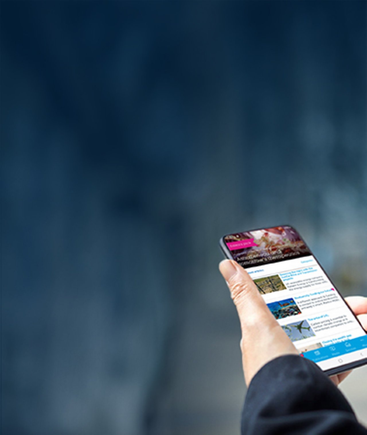 Business man holding a mobile phone displaying the flow app