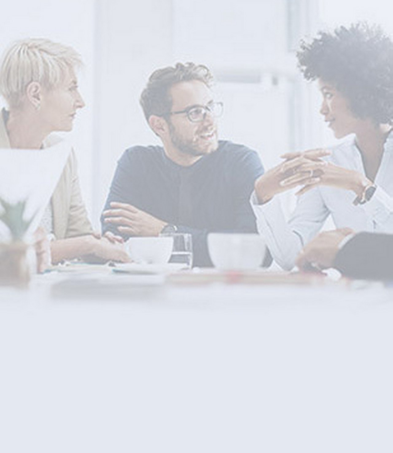 team of young professionals discussing during a meeting