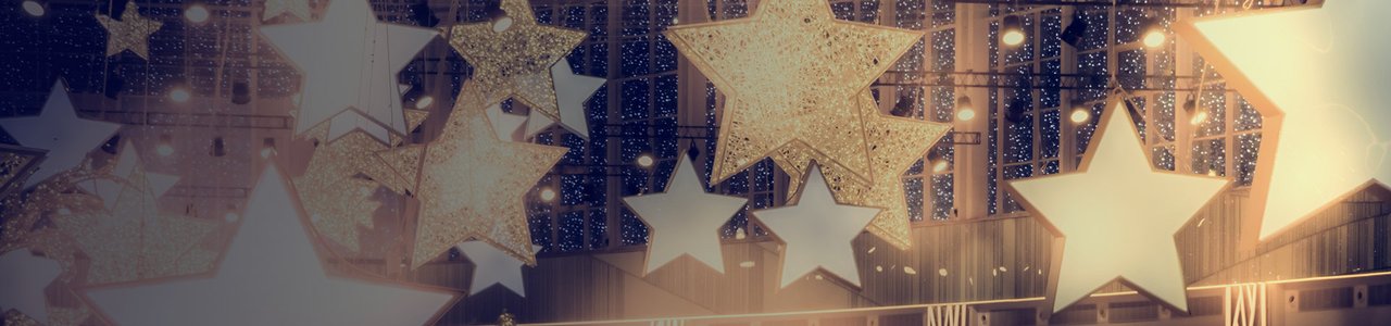 Golden Stars warmly illuminated hanging from the ceiling