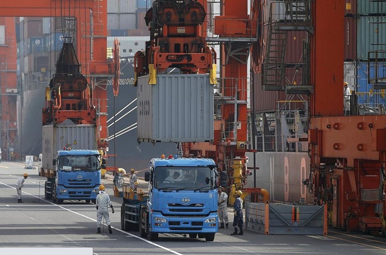 Trucks are loaded at a container port