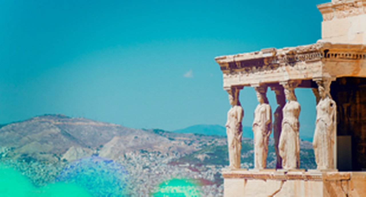 old temple on the right in front of colorful dessert and blue sky
