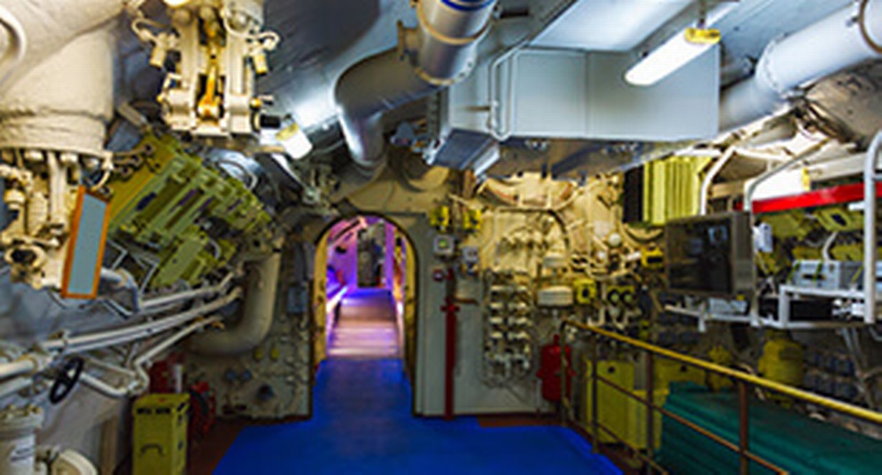 A modern complex ship's engine room indirectly illuminated