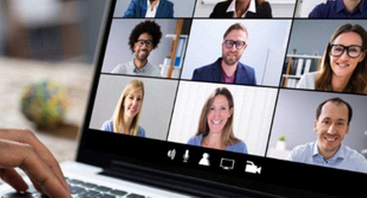 A virtual conference shown on a laptop screen