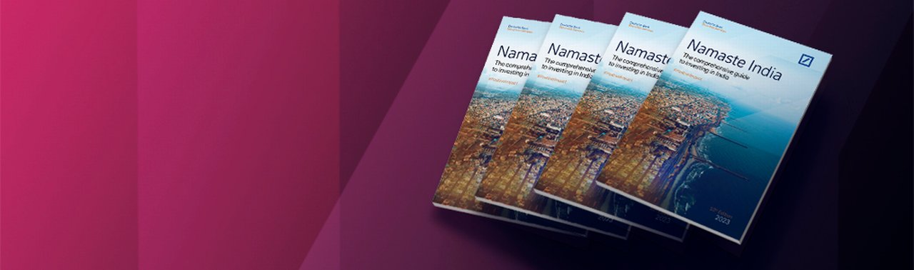 Several Namaste India magazines being presented on an abstract magenta background