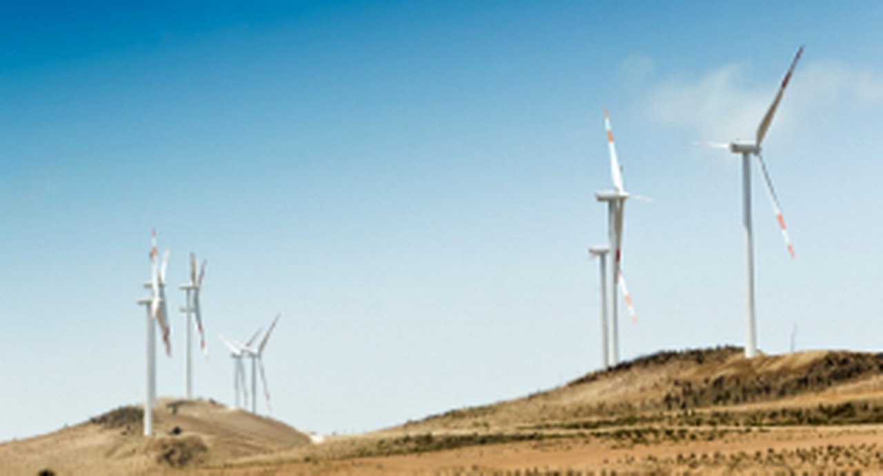 Windmills on hills facing the gales