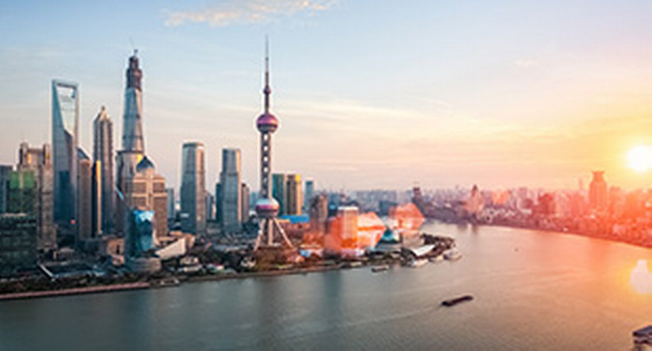 shanghai at dusk, huangpu river and financial district skyline in sunset