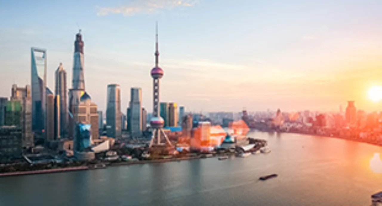 shanghai at dusk, huangpu river and financial district skyline in sunset