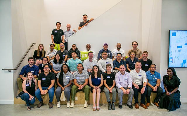 Deutsche Bank Americas Foundation employees gathered on a staircase