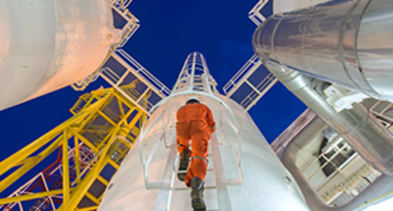 Engineering climb up to oil and gas process plant to observer gas dehydration processing in night shift