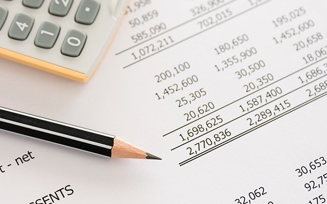 Pencil on an accounting ledger