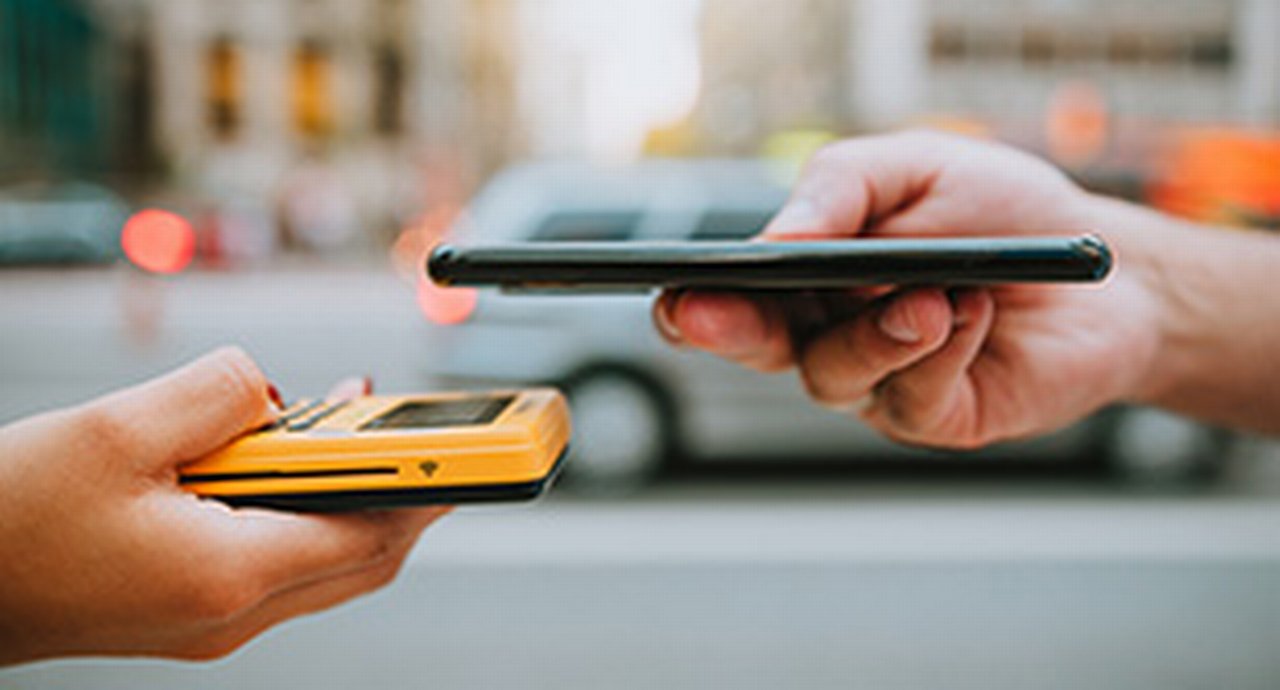 Close-up of two smartphones in a payment transaction