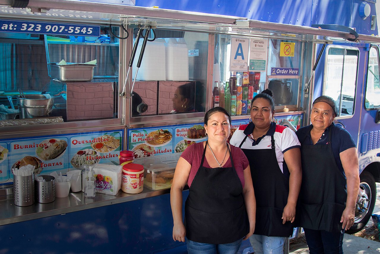Small business owners with a food truck financed by Opportunity Fund