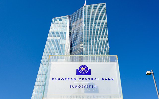 Low angle view of the sign and logo of the European Central Bank at the southern entrance of the Skytower building, headquarters of the ECB since 2015.