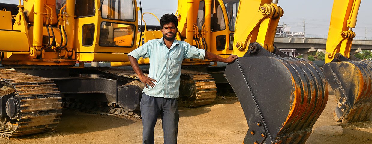 Construction worker near construction machinery