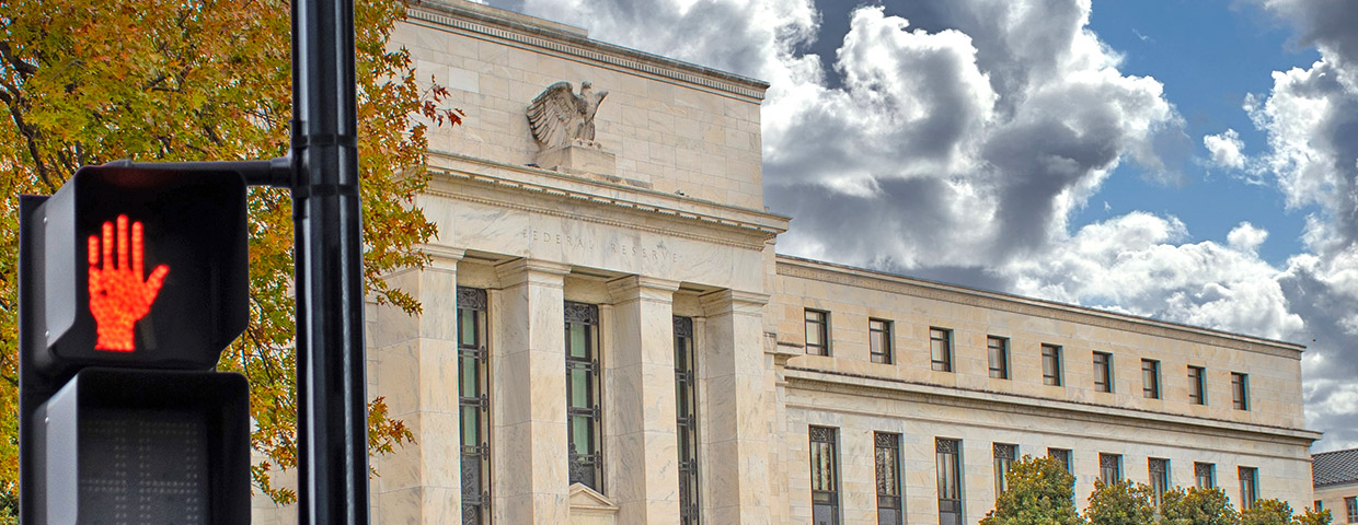 Federal Reserve Building with a stop sign