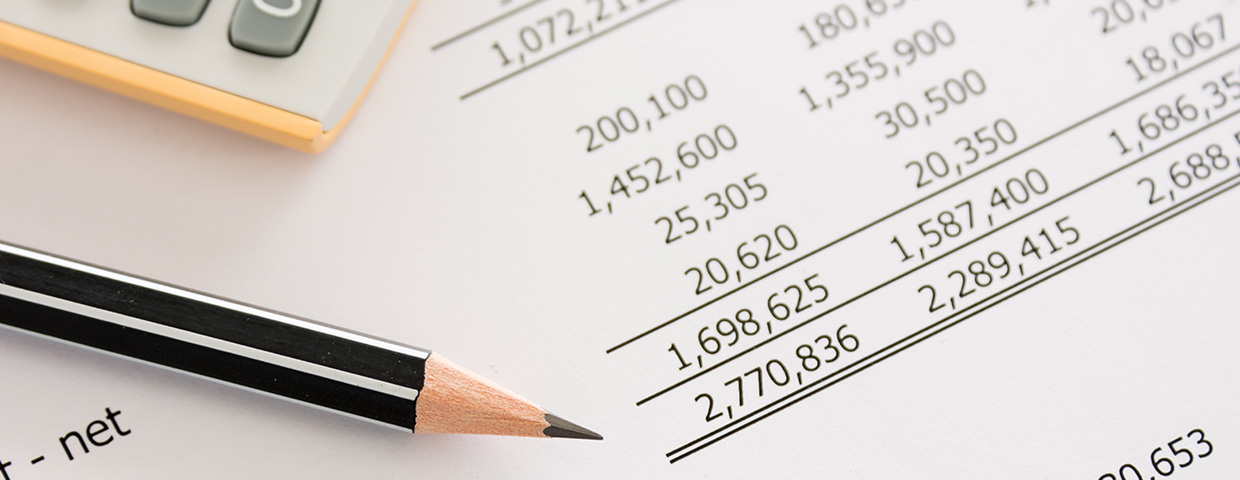 Pencil on an accounting ledger